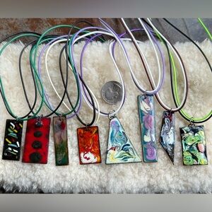 8 vintage (60’s) copper and enamel pendants 1.75-2.75” long. Beautiful patterns